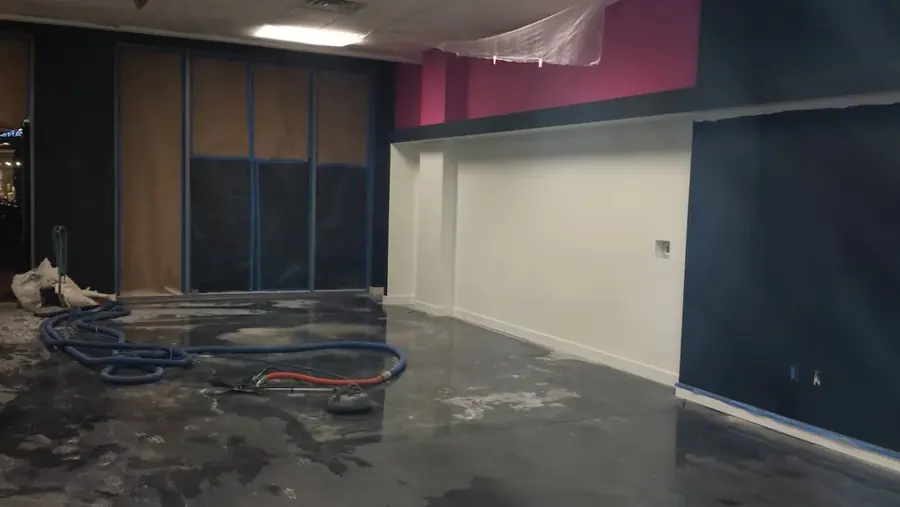 Restoration crew pumping out a flooded Las Vegas ground floor after a monsoon storm